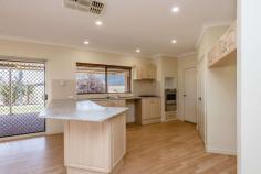  1 Fisher Cove Mount Tarcoola WA 6530 This was an award winner when it was built and easy to see why. Built by Admiration in 2001, this Brick and Colorbond home has stood the test of time and has most of the essentials a family requires. 4 good sized bedrooms with robes, 2 bathrooms with the the ensuite toilet having dual access, High ceilings, 2 large living areas, a double garage made for 2 big cars, direct access into the kitchen with double fridge space, extra high benches, gas stove top, 60 m2 Patio, fenced yards, natural gas, deep sewer & NBN connected. There is side access from Fisher Street and if required, you could do the same from Reg Percy. The gardening upkeep is very, very minimal with a neat front yard and no lawn yet, 1 Fisher looks great! Mount Tarcoola remains one of Geraldton's most popular suburbs with the proximity to the CBD, Wandina Shopping Centre and schools being a big draw card and just a few minutes drive down the hill and you are on the beach! Vacant possession is available however, there is also an excellent tenant in place who is keen to stay if possible. 