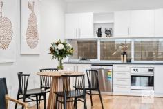  13 Florey Pl Adelaide SA 5000 Built in 2003, this beautifully presented tri-level townhome is ideally positioned, walk to the tram on King William Road, taking you into the CBD & Glenelg. There is easy access to two, 7-day, late night IGA supermarkets, one in Gilbert St, the other in Hutt St. Stroll to the popular ‘Greek on Halifax’, Herringbone, La Trattoria & cafes along Halifax & Gilles streets. Entry is via either from Howard Florey St, or Catherine Helen Spence St. The home is set in a neat & quiet row of townhouses, offering perfect north/south orientation. Direct access into the home is provided from the double-length garage with an automatic roller door. The laundry facilities are in the garage, complete with white laminate sliding doors to extensive storage including provision to store your rubbish bins in a nook under the stairs. From the moment you step inside, you are sure to be impressed by the fresh contemporary décor, featuring new latte-toned plush pile carpet & white walls. Middle Level:- There are 2 double bedrooms, both fitted with white laminate sliding robes. The main bedroom enjoys large picture windows, inviting the northern winter sun, whilst bedroom 2 offers a sliding door (+ screen) opening to a tiled-floor open-air atrium. Ideally, there are 2 matching bathrooms, one on either side of the bedrooms. A twin-door linen press is provided, along with the control panel for the zoned, ducted reverse-cycle air-conditioning system. Upper Floor:- The well-equipped kitchen is fitted with crisp white laminate cupboards & a charcoal-toned laminate benchtop. The kitchen windows provide good natural light from the open void. There is an electric cooktop, stainless steel under-bench oven, Dishlex dishwasher, pantry & appliance cupboard. The kitchen is lined with newly polished timber floorboards, adjoining spacious & light-filled, north-facing open plan dining & living areas, including LED downlights. Floor-to-ceiling windows invite loads of natural light & a sliding door (with screens) open to a tiled floor balcony with frosted glass balustrade – the ideal spot for alfresco dining. Extras Include:- Ducted r/c air-conditioning, insulated ceilings & walls, custom fitted blinds, hard-wired smoke alarm & NBN capability. 