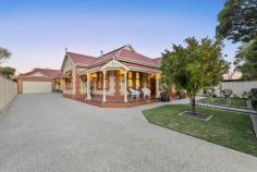  93 Fifth Ave Joslin SA 5070 This impressive Sandstone villa offers truly outstanding family accommodation. Set behind secure fencing with an automatic gate and intercom, you're welcomed by manicured gardens, a tiled return-veranda and a charming character façade. Upon entry, the luxury and spaciousness of the home is evident as you wander down the 22-metre hallway featuring solid Jarrah timber floorboards, decorative arches, and elegant ornate ceilings. The generous study/home office or potential fourth bedroom overlooks the front gardens through lovely leadlight windows. Across the hall is the beautiful primary suite, boasting a stunning walk-in closet with extensive custom-built storage. The indulgent ensuite, with floor-to-ceiling marble tiles features underfloor heating, mirrored cabinets a huge free-standing bath and spacious over-head rain shower. The primary suite is complete with a convenient separate powder room/wc. Spend a cosy night around the gas-log fire in the family sitting room, with wall to floor cabinetry featuring beautiful tile work and built-in shelving providing a high-quality finish. Downstairs, there's a hidden surprise - a huge cellar room that provides endless possibilities as a gym, wine room or theatre, or perhaps a kids/teenagers retreat if you'd like. Back up the stairs and off the hallway are two generous bedrooms, one features a large built-in-robe. Servicing these bedrooms is a three-way family bathroom with a double vanity, spacious shower, free standing bath, heated towel rails and two separately located wc. Also off the hall is the impressive laundry room boasting copious amounts of bench space and storage, including convenient drying/hanging space. The impressive hallway draws you down to the heart of the home. The open plan kitchen, living and dining areas showcase a contemporary eye for design and flows seamlessly out to the entertaining area that is under the main roof. The premium kitchen is fit for a chef with an integrated refrigerator, Miele dishwasher, AEG gas cooktop and triple oven. With an abundance of bench space, striking mirrored splash back and shelving also featuring low-set large bar fridge, the kitchen doubles as a stylish bar that will set a scene of modern luxury while you to host and entertain. Designed with entertaining in mind, glass slide-away doors allow for seamless indoor/outdoor living while creating a year-round outstanding entertaining pavilion. Overlooking the sparkling in-ground pool, the area features ceiling fans, Bluetooth speakers, and heaters plus a built-in BBQ and second bar fridge. Structured and purposely designed, the garden illuminates at night to provide a stunning back-drop and a place of serenity. The home's surprises continue with a separate full-size kitchen located at the rear of the property, that includes a second dishwasher and full-sized wood fired pizza oven. Along-side this excellent family home is the dual double side-by-side garage with automatic panel-lift door allowing access from the front, the rear roller door provides direct access to entertaining area and there is internal entry into the home. - Ducted reverse cycle air-conditioning throughout - 2x gas log fireplaces, in family room and open plan living - Gourmet kitchen features triple AEG oven, including steam,and gas cooktop plus Miele integrated refrigerator with ice maker and Miele dishwasher. - Beautiful marble benchtops and glass splashback in kitchen - Kitchen doubles as full-size bar with ample low-set bar fridge space - Salt chlorinated swimming pool lined with Travertine coping - Convenient robotic swimming pool vacuum - Secure fence with automatic electric gate & intercom security system. - Security camera system installed to connect to your phone or Ipad. - Large slide-away glass doors from living area, creating a huge indoor/outdoor entertaining space with additional slide-away screen doors - Outdoor retractable 98% block-out blinds, ceiling heaters & huge ceiling fans. - Blue tooth speakers to family and entertaining areas. - Automatic irrigation system to gardens + underground watering system to rear lawn area. - Established manicured gardens include a thriving Mandarin tree - Beautiful outdoor lighting to front and rear gardens, up lights along pathways and driveway. - High rise fencing and decorative screening to rear garden, ideal for privacy - Separate WC & shower for pool area - Fantastic outdoor entertaining pavilion with BBQ connected to mains gas plus second bar fridge - An additional full kitchen, with second dishwasher, at the rear of the property with large stone wood fired pizza oven. - Spacious cellar, which provides endless possibilities (currently used as a gym) - Spacious 3-way family bathroom with 2x separately located toilets – perfect for those busy mornings - Gorgeous ensuite with underfloor heating, family bathroom with heated towel rails - Copious amounts of storage throughout the home including a truly magnificent walk-in closet to the primary bedroom suite, hallway linen cupboards and an abundance of designer cabinetry to family room, open plan area, laundry, and bathrooms 