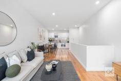  13 Florey Pl Adelaide SA 5000 Built in 2003, this beautifully presented tri-level townhome is ideally positioned, walk to the tram on King William Road, taking you into the CBD & Glenelg. There is easy access to two, 7-day, late night IGA supermarkets, one in Gilbert St, the other in Hutt St. Stroll to the popular ‘Greek on Halifax’, Herringbone, La Trattoria & cafes along Halifax & Gilles streets. Entry is via either from Howard Florey St, or Catherine Helen Spence St. The home is set in a neat & quiet row of townhouses, offering perfect north/south orientation. Direct access into the home is provided from the double-length garage with an automatic roller door. The laundry facilities are in the garage, complete with white laminate sliding doors to extensive storage including provision to store your rubbish bins in a nook under the stairs. From the moment you step inside, you are sure to be impressed by the fresh contemporary décor, featuring new latte-toned plush pile carpet & white walls. Middle Level:- There are 2 double bedrooms, both fitted with white laminate sliding robes. The main bedroom enjoys large picture windows, inviting the northern winter sun, whilst bedroom 2 offers a sliding door (+ screen) opening to a tiled-floor open-air atrium. Ideally, there are 2 matching bathrooms, one on either side of the bedrooms. A twin-door linen press is provided, along with the control panel for the zoned, ducted reverse-cycle air-conditioning system. Upper Floor:- The well-equipped kitchen is fitted with crisp white laminate cupboards & a charcoal-toned laminate benchtop. The kitchen windows provide good natural light from the open void. There is an electric cooktop, stainless steel under-bench oven, Dishlex dishwasher, pantry & appliance cupboard. The kitchen is lined with newly polished timber floorboards, adjoining spacious & light-filled, north-facing open plan dining & living areas, including LED downlights. Floor-to-ceiling windows invite loads of natural light & a sliding door (with screens) open to a tiled floor balcony with frosted glass balustrade – the ideal spot for alfresco dining. Extras Include:- Ducted r/c air-conditioning, insulated ceilings & walls, custom fitted blinds, hard-wired smoke alarm & NBN capability. 