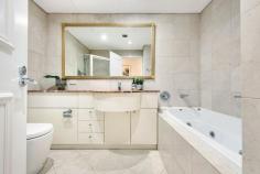  Unit 207/1 Roseby St Drummoyne NSW 2047 This convenient level-entry apartment in a luxury complex delivers exceptional space and comfort. Situated on the ground floor in East Drummoyne's exclusive Marina Point Apartments, the two-bedroom home features a generous and low-maintenance layout that's designed for a relaxed lifestyle. Unwind in the sunlit lounge with floor-to-ceiling glass doors that create a seamless flow between the living space and a wraparound entertainer's terrace framed by tropical greenery. Two spacious bedrooms include a light-filled master with built-in-robe and designer marble ensuite with spa bath. Head outdoors and explore local waterfront parks and walking trails, or make use of the onsite resort-style facilities, such as an indoor heated pool, and gym. This sought-after address is only 50m to Birkenhead Pt retail, 190m to Drummoyne Sailing Club, and 500m to the famous Bay Run. • High-quality two-bedroom apartment in a coveted waterfront location • Bright and airy open-plan living and dining space with seamless flow to terrace • Quality gas kitchen featuring Blanco gas oven, and stone benchtops • King-sized master includes built-in robe, and ensuite with shower, spa bath and vanity • Spacious guest bedroom featuring built-in robe and leafy outlook • Large internal laundry with room for washer and dryer, plus storage space • Wide wraparound balcony, perfect for alfresco dining and entertaining • Carpeted throughout. Ducted air conditioning. Internal storage room. • Secure, undercover single space parking. 