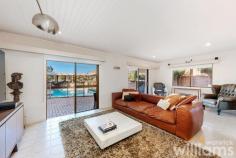  26 Swannell Avenue Chiswick NSW 2046 With a prestigious bayside address, captivating water views, and a sparkling in-ground pool, this spacious four-bedroom villa is ready to be transformed into a stunning forever home (STCA). Bathed in sunlight, the solid double-brick built property delivers a generous interior layout that flows seamlessly over two levels. Designed for busy family life, the lower level includes a large home office, bright and spacious kitchen, plus a relaxed lounge with pool outlook. The expansive upper level capitalises on the prized location with unobstructed views across Five Dock Bay and Lysaght Park, while outdoors there are options to soak up rays on the poolside deck or dine al fresco with friends under the covered terrace. Step outside the front door to enjoy waterfront walking trails and parks, or take a stroll to Chiswick's cafes, eateries and the CBD ferry - all within 700m. • Four-bedroom family home in an enviable setting with water and park views • Comfortable as is, with exciting potential for a dream redesign (STCA) • Master suite includes ensuite, air conditioning, built-in robe, and panoramic views • Three large guest bedrooms feature ceiling fans and air conditioning. • Upper-level guest bathroom with combined bath and shower • Spacious electric kitchen, featuring Bosch dishwasher and plenty of storage • Lounge with pool outlook. Office space and retractable screen. Powder room • Secure storage unit to the rear. Paved courtyard. Off-street covered parking for two cars • Resort-style in-ground pool featuring covered deck and entertaining terrace 