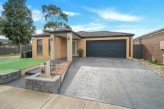  29 Mayesbrook Rd Manor Lakes VIC 3024 Presenting a residence that boasts three generously sized bedrooms, this property enjoys a prime location in close proximity to the Wyndham Train Station and local schools. The master bedroom is equipped with His and Her robes as well as an ensuite, and features such as a ceiling fan and hybrid wooden floors enhance the ambiance. With a focus on convenience, the double garage offers remote control access and internal entry. The kitchen, designed for spaciousness, is complete with modern amenities including a dishwasher and ample storage solutions. Additional highlights of this home include built-in robes in the second and third bedrooms, ducted heating, and evaporative cooling for year-round comfort. The outdoor area, designed for low maintenance living, features a concrete pathway, pergola, and a practical garden shed. 