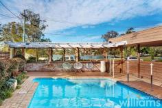  26 Swannell Avenue Chiswick NSW 2046 With a prestigious bayside address, captivating water views, and a sparkling in-ground pool, this spacious four-bedroom villa is ready to be transformed into a stunning forever home (STCA). Bathed in sunlight, the solid double-brick built property delivers a generous interior layout that flows seamlessly over two levels. Designed for busy family life, the lower level includes a large home office, bright and spacious kitchen, plus a relaxed lounge with pool outlook. The expansive upper level capitalises on the prized location with unobstructed views across Five Dock Bay and Lysaght Park, while outdoors there are options to soak up rays on the poolside deck or dine al fresco with friends under the covered terrace. Step outside the front door to enjoy waterfront walking trails and parks, or take a stroll to Chiswick's cafes, eateries and the CBD ferry - all within 700m. • Four-bedroom family home in an enviable setting with water and park views • Comfortable as is, with exciting potential for a dream redesign (STCA) • Master suite includes ensuite, air conditioning, built-in robe, and panoramic views • Three large guest bedrooms feature ceiling fans and air conditioning. • Upper-level guest bathroom with combined bath and shower • Spacious electric kitchen, featuring Bosch dishwasher and plenty of storage • Lounge with pool outlook. Office space and retractable screen. Powder room • Secure storage unit to the rear. Paved courtyard. Off-street covered parking for two cars • Resort-style in-ground pool featuring covered deck and entertaining terrace 