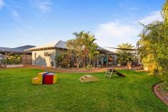  6 Parris Way Bilingurr WA 6725 $679,000 Beautifully constructed and presenting near-new, every aspect of this stunning 3 bed, 2 bath home has been carefully thought out to deliver modern, family living - the way it's meant to be. Tucked away on a quiet, family-friendly street in the vibrant Broome North community, you'll discover feature-packed family living in a location you'll love. From the front the home boasts great street appeal thanks to manicured, low-maintenance tropical gardens and mature feature Boabs. Up the concrete drive you'll find the big double carport with feature timber panelling with room for two large vehicles. Additional driveway parking is available with roller door entry to the large workshop and gated side access to the rear for secure boat/trailer storage. Built in 2016 by the current owner occupiers, the home has been designed with modern family living in mind with a seamless blend of space, style, features and functionality. The light and bright interior boasts spacious open-plan living and dining areas with beautiful wood flooring, a fresh and neutral colour palate and an abundance of natural light throughout. At the heart of the home is the modern kitchen with white gloss cabinetry, built-in pantry, feature tiled splashback, stainless steel appliances, Chef's oven and floating island bench. Other key features include modern main bathroom with louvre windows and separate shower and bath, separate laundry, split cycle aircons throughout, modern downlights, window blinds and more! The added solar package with battery will help keep costs down by minimising your power bills to just one or two in the wet season. The home itself boasts 3 big bedrooms, all with built-in robes, ceiling fans and air-con, including the Master complete with walk-in robe and private ensuite. Beautifully crafted both inside and out, entertaining is made easy thanks to the rear undercover alfresco area, complete with polished timber decking and ceiling fan, overlooking an expansive rear yard with mature tropical gardens and plenty of lush green grass for the kids and pets to play. The separate shaded sitting area is perfect for a fire pit while the raised garden beds make growing your own produce easy. The large shed with mezzanine and roof space storage is the perfect project space while there's more than enough room to sink a pool. Located within walking distance to a number of local parks with fantastic playground equipment, and close to Broome North Primary School and a short drive from Cable Beach, it's the vibrant, community style living the whole family will enjoy. 