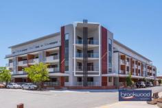  18/21 Foundry Road Midland WA 6056 $319,000 Put yourself at the centre of Midland’s industrial-chic renewal. Located at the heart of the Railway Square heritage precinct, this 2-bedroom, 1-bathroom apartment boasts an industrial-chic streetscape with exceptional access to St John of God Hospital and Midland train station with links to the Perth CBD. Modern styling, a large balcony offering sunset vistas and undercover parking deliver the best of urban living with easy access to the gourmet delights of the Swan Valley and the natural beauty of the Perth Hills. 2 bedrooms 1 bathroom Modern urban apartment OP kitchen meals lounge First floor with big balcony Main bed w balcony access Fob entry & lift UC parking Neutral colour scheme Well maintained complex Heritage precinct setting Walk hospital train shops Secure parking and lift access make coming home a breeze; open-plan living, a deep, wide balcony and light-filled interiors make staying home a delight. Take possession of a modern, first-floor property only minutes from St John of God Hospital and rail links to the Perth CBD and enjoy the freedom of apartment living in an exciting Heritage precinct. An open-plan kitchen/meals/lounge leading to an expansive balcony offers indoor-outdoor living with sunset views. A 4-burner electric hob, dishwasher, and electric oven make for stress-free meal prep and kitchen clean-up.Two good-sized bedrooms, one with balcony access, both with built-in robes, sit to one side of the central living area, along with a good-sized bathroom and European laundry.The apartment complex is well-maintained and features a central courtyard garden. Put yourself at the heart of an urban revival and within easy reach of the services and amenities of Midland and beyond with this bright, easy-living apartment. To arrange an inspection of this property, call Ken Wiggins on 0403 012 950. 