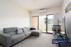  18/21 Foundry Road Midland WA 6056 $319,000 Put yourself at the centre of Midland’s industrial-chic renewal. Located at the heart of the Railway Square heritage precinct, this 2-bedroom, 1-bathroom apartment boasts an industrial-chic streetscape with exceptional access to St John of God Hospital and Midland train station with links to the Perth CBD. Modern styling, a large balcony offering sunset vistas and undercover parking deliver the best of urban living with easy access to the gourmet delights of the Swan Valley and the natural beauty of the Perth Hills. 2 bedrooms 1 bathroom Modern urban apartment OP kitchen meals lounge First floor with big balcony Main bed w balcony access Fob entry & lift UC parking Neutral colour scheme Well maintained complex Heritage precinct setting Walk hospital train shops Secure parking and lift access make coming home a breeze; open-plan living, a deep, wide balcony and light-filled interiors make staying home a delight. Take possession of a modern, first-floor property only minutes from St John of God Hospital and rail links to the Perth CBD and enjoy the freedom of apartment living in an exciting Heritage precinct. An open-plan kitchen/meals/lounge leading to an expansive balcony offers indoor-outdoor living with sunset views. A 4-burner electric hob, dishwasher, and electric oven make for stress-free meal prep and kitchen clean-up.Two good-sized bedrooms, one with balcony access, both with built-in robes, sit to one side of the central living area, along with a good-sized bathroom and European laundry.The apartment complex is well-maintained and features a central courtyard garden. Put yourself at the heart of an urban revival and within easy reach of the services and amenities of Midland and beyond with this bright, easy-living apartment. To arrange an inspection of this property, call Ken Wiggins on 0403 012 950. 
