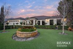  28 Berlotto Dr Ashby WA 6065 $800,000 This remarkable residence will take your breath away, from the manicured, established front landscaping to the resort style outdoor entertaining areas with lagoon style pool surrounded by lush, tropical, botanical gardens. Love at first sight is guaranteed! Features & benefits include: * Stunning, landscaped front gardens * Double door entrance * Entrance hall * Home theatre * Study / home office * Open plan family & meals areas * Quality kitchen with breakfast bar, double fridge / freezer recess, pantry, feature bulkhead with pendant lighting & dishwasher * Separate games room * Shoppers access from the garage * Master bedroom suite with walk in robe, sliding door to courtyard area & ensuite with twin vanities, shower & separate WC * 3 further spacious bedrooms with built in robes * Family bathroom with vanity, shower & bath * 2nd WC * Fitted laundry with walk in linen cupboard, broom cupboard, bench space & overhead cupboards * Reverse cycle, ducted, zoned air conditioning * 3 phase power * Skirting boards * Decked alfresco with raked timber lined ceiling, ceiling fan & log burner * Thatched gazebo with power, light & cold-water feed for fridge * Synthetic lawn area for the kids & pets * Ornate Koi pond with waterfall * Sparkling, below ground pool with feature lighting & illuminated rain curtain water feature * Bore reticulation * Double, remote garage * Stunning, established tropical gardens * Large 647sqm block * Situated across from Conti Reserve bushland & Carosa Park * Close to schools, transport, shops & all other local amenities 