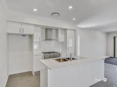  33 Sierra Dr Ipswich QLD 4300 $700,000 Promising to capture the attention of families, investors and entry-level buyers alike, this dual-level property is just a stone’s throw from Orion Springfield Central’s conveniences and the magnificent Whites Rock Spring Mountain Conservation Estate. Also close to esteemed schools and Robelle Domain’s popular parklands, this exceptional residence boasts immaculate interiors and a picturesque outlook. Situated adjacent to verdant greenspace, the home features a classic facade, established gardens and an elevated aspect. Inside, sleek tiled and carpeted floors are complemented by a calming neutral colour palette. Forming the heart of the property, a spacious open-plan living and dining area is situated on the residence’s upper level. Capturing wonderful natural light, this impeccable central space spills out onto a covered front balcony commanding leafy views. Here, share an al fresco meal, toast the sunset or simply unwind with your morning coffee and admire the delightful vista. Finishing the central living area, a sensational kitchen displays stone benchtops, stainless-steel appliances and ample cupboard storage. You will also find an ensuited master bedroom showcasing a walk-in robe and a private balcony. Three additional bedrooms encompassing built-in robes are serviced by a well-appointed main bathroom, which has a separate bath, shower and toilet. Complete with a secure dual garage and a fully-fenced grassed rear yard on the ground level, the home also includes an internal laundry, superb storage, ducted air-conditioning and ceiling fans. Minutes from a slew of shops and dining options, this fantastic property is near the city-bound Centenary Highway, the Springfield Central train station and White Rock Spring Mountain Conservation Estate’s walking tracks. Falling within the Spring Mountain State School and Springfield Central State High School catchment areas, this outstanding residence is also a short drive from Saint Peters Springfield, Good Shepherd Catholic Primary School and The Springfield Anglican College. The University of Southern Queensland’s Springfield campus is easily accessible from this address, as well.  