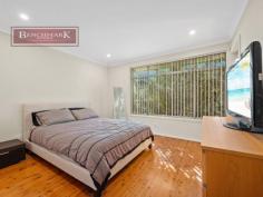  1 Bainbridge Ave Chipping Norton NSW 2170 Discover the perfect family home in a quiet street, close to lakeside walkways, shops, schools, and public transport. This single-level property boasts good-sized rooms with solid timber floors throughout, offering a warm and inviting atmosphere. The updated kitchen and bathroom add a modern touch to the home, while the walk-in wardrobe in the main bedroom provides ample storage space. The rear access makes parking easy and convenient, as well as a single lock-up garage. Enjoy your leisure time in the privacy of your own backyard with an enticing in-ground swimming pool, perfect for entertaining friends and family. Don't miss this opportunity to live in the highly sought-after Newbridge Heights school catchment area. Experience the comfort, convenience, and serenity of this fantastic home schedule a viewing today! 