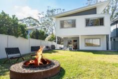  12A Longview Crescent Stanwell Tops NSW 2508 $2,000,000 to $2,200,000 This executive residence combines a stylish contemporary design with top of range inclusions and has been finished with flawless execution. The coastal theme home fits the location perfectly with some of the most stunning surfing beaches and best cafes the Illawarra coast has to offer only minutes drive away. From the moment you walk through the front door you will feel right at home in this luxury appointed coastal residence! HOME & FEATURES * Near new architecturally designed, split level home boasting the highest quality of finishes throughout. * Open plan design with spacious airy feeling throughout the home. * Designer kitchen fitted with high-end appliances, breakfast bar and solid marble benchtops. * Featuring four very spacious bedrooms. The impressive main bedroom is an ideal parents retreat, set on it's own level with an ensuite, huge walk-in robe, private balcony overlooking the bush and space for a home office or sitting area. * High ceilings and large windows attract vast light and provide great cross ventilation. * Modern and stylish main bathroom with additional powder rooms on the ground and first floor. * Secure parking in a one and a half sized lock up garage with internal access to home. * Unique facade designs, including selection of mixed claddings and hand selected recycled bricks. * Solid Blackbutt tongue & groove flooring in main living and custom recycled hardwood joinery throughout. * Stay comfortable all year-round with Actron 3 Zone ducted air conditioning. * Land size 585m2 (approx.) with R2 residential zoning and Torrens Title occupancy. LOCATION & LIFESTYLE * Perfectly positioned in a peaceful leafy street with direct access to parklands at the rear via a gate in the back fence. Ideal setting for families. * Ideally located within a short commute to Stanwell Park Village, beach, park, cafes shops and local primary schools. Embrace coastal living with swimming, fishing, bushwalking, hang gliding and picnics in popular parklands all available at your doorstep. * Convenient position for commuters with a bus stop situated only seconds from your home and express trains to Sydney from nearby Helensburgh train station. * Only a short stroll to Stanwell Tops lookout to view the beach, surf and flying conditions from the end of the street. * Stanwell Tops is situated at the southern end of the Royal National Park and offers a tranquil lifestyle with an easy access to Sydney (1 hour) and Wollongong (25 minutes) as well as all that this pristine coastline has to offer. 