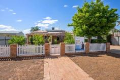 4 Seinor Street SOMERVILLE WA 6430 $520,000 This gorgeous 4-bedroom brick and iron family home set behind a white picket fence and a beautifully manicured front yard. With local shops, parks, pubs, and a rec centre just a short walk from the front door, this location has something for everyone in the family. Internally, this home ticks all the boxes, large master suite with walk-in-robe and en-suite, 3 further bedrooms all with built in robes, generous open-plan kitchen, living and dining area, second living area/theatre room, family bathroom with bath and shower and a large laundry. Step out through the sliding glass door onto the large, L-shaped, entertaining patio, overlooking an established and well-kept back lawn. Look to the right and you will find a 6 by 4 powered workshop, complete with air conditioning. This home is solar powered and natural gas connected. 