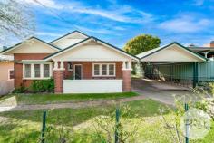  9 Coleman Street Turvey Park NSW 2650 $1,050,000 Welcome to 9 Coleman Street, Turvey Park! This stunning 4-bedroom, 2-bathroom house is the perfect family home, offering spacious living areas and a range of desirable features on a 3 tiered home. Located on the highly desirable end of Coleman Street, you are walking distance to TAFE, Wagga High, Kildare Catholic College, the Wagga CBD and great cafes and parks. Situated on a generous 689sqm block, this property boasts a beautiful backyard and balcony, providing ample space for outdoor entertaining and relaxation. The well-designed architecture of the house creates a stylish and modern atmosphere, with hardwood flooring throughout the living areas, high ornate ceilings and beuatiful period features throughout. The interior of the house is thoughtfully designed, freshly painted throughout, its light and bright and oozes charm, character and light. With a spacious dining room and living room that flow seamlessly together. The kitchen is equipped with ample storage space. The bedrooms are all generously sized, providing plenty of space for the whole family with built in wardrobes to all. The master bedroom features an ensuite bathroom and a built-in wardrobe, creating a luxurious retreat to the rear of the home. Downstairs is access internally or via the backyard and can create the perfect home office, kids retreat, rumpus room or home gym set up, opening up onto the large backyard with a northerly aspect. There is plenty of space for parking with a double carport to the front and large single shed through the gates. Solar installed which will minimise those rising electricity costs. The complete Turvey Package! This home is sure to tick the boxes. 