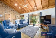  930 Houston St Mount Helena WA 6082 $849,000 Escape into the enchantment of nature and days filled with birdsong and the antics of native wildlife. This 4-bedroom, 2-bathroom home embodies Hills living with a stylish modern kitchen, soaring, timber-lined ceilings and fully tiled bathrooms. A central open plan, flanked by adult and junior wings, radiates an air of grandeur equalled by the natural splendour of the 4.34-acre site. 4 beds 2 baths plus study 1991-built brick and iron Stylish open plan kitchen Soaring ceiling exp beams Separate junior bed wing Wrap-around verandah 12m x 6m pwd workshop 6 kW solar array bore tanks Natural 4.34-acre block Close schools Mundaring Step inside the open-plan living zone to discover a faultless merging of natural and built environments. Morning sun through a leadlight window casts colourful patterns on the floor, soft, natural tones and organic textures echo the surrounding landscape. Raked ceilings lined with honey-toned timber bring a sense of space and stillness to the heart of this home. A sunken den – or study – and built-in bar arranged at one corner of the family room ensure a welcoming atmosphere with ample space for socialising. Add to the picture a slow combustion fire, reverse cycle air-conditioning, a floorplan that flows to the outdoor entertaining area and spa, and a kitchen that’s sure to inspire culinary triumphs, and it’s easy to visualise years of making memories with friends and family. The kitchen boasts an open-plan layout and features a stone waterfall-end benchtop with integrated breakfast bar. Equipped with an electric cooktop, wall oven and dishwasher, this cooks’ haven is sure to inspire gastronomic triumphs. Abundant storage is provided by deep drawers, tall cabinets, and a central island. A paved and sheltered outdoor entertaining zone extends from the open-plan kitchen and meals area. Set against a painterly landscape of dappled light, lush lawn and the sculptural forms of tall eucalypts – a vista also available from the decked, above-ground pool and spa – this oasis of calm and nature’s magnificence is an unbeatable setting for getting together with friends and family or simply whiling away a lazy afternoon. At the west of the plan is a restful parents’ retreat comprising a large bedroom, a walk-in robe and an ensuite. A sliding door onto the front verandah leads to an idyllic setting for sharing a quiet breakfast together. Three junior bedrooms, a shared family bathroom and separate WC form the junior wing at the opposite end of the home. A walk-through laundry completes the layout in the junior wing. Towards the southern boundary, a powered workshop awaits those with a project in the works – or on the horizon. Drive-in access and an adjoining concrete apron make this a practical workspace. Space for vegetable gardens, fenced holding yards with shelters and a chicken coop offer opportunities to fully embrace a Hills lifestyle. Hours of adventurous play and discovery await with more than 4 acres to explore, further afield, a local access track leads to kilometres of walking and riding along the Heritage Trail. Immersed in a breathtaking natural setting and bordering a serene reserve, this impressive property rests gently in its setting and displays an effortless combination of timeless charm and modern elegance. 