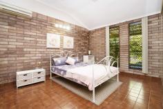  13 Copra Crescent Karama NT 0812 $450,000 Arriving at this home, you are greeted by the most glorious, lush, tropical gardens. Lovingly cared for, these well-established gardens are simply a joy to behold. You'll see an ample lawn to the front and the rear garden is vast making for a dream family enclave. With parking for 2 cars, step inside the cool of this solid brick home. Entering the bright living space, you will be struck by the high ceilings and immaculate order of this property. While there is potential to modernise this space, it is in move in condition and prepared to host family life. The open plan living and dining area adjoins the neat kitchen, all with views to the beautiful rear garden. The kitchen is perfectly positioned to oversee any smaller family member's activities, both indoor and out. From the living area, sliding doors lead to a peaceful verandah extending the length of the home. Great for dining or just relaxation and overlooking the stunning lawn. Stepping back inside, we visit the first of three bedrooms. This room with built in robe, ceiling fan and air-conditioning offers the perfect position to function as a work from home space or study. Bedroom two is similarly appointed and sits opposite the main family bathroom. While this bathroom boasts original features and a separate WC, you will see potential to add your personal touch here. The master suite is bright and airy, with generous proportions, built in robes and ensuite. The laundry is conveniently located next to the main bathroom and offers its own entrance to the garden, giving easy access to the paved drying area with Hills Hoist. Just moments from the Casuarina Shopping Hub and close to university and hospital, this original owner-occupied home is primed to become a much-loved family residence. 