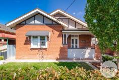  22 Murray Street Wagga Wagga NSW 2650 The perfect story book composition - meticulously restored red brick enhanced by a gorgeous palette of fine touches and charming character. Ideally located within Wagga's medical precinct, is this pretty, four-bedroom red brick cottage. An empathetic and stylish renovation has completed the home for modern family life while affectionately respecting its heritage roots. Subtle neutral colours marry with the original timber flooring and windows. The kitchen, dining and living is airy and sunlit, with high ornate ceilings and stunning timber floors. Ducted reverse cycle heating and cooling throughout and plantation shutters filter light, screening the comings and goings of the street. The front yard gifts peaceful glimpses of verdant green. This is a gorgeous nook for morning coffee or equally a blissful stage for an evening glass or two. The kitchen is well appointed, with generous stone countertops, two-pac cabinetry and ample storage, think easy meals with lots of room for family communion around the dining table. Four generous bedrooms, three with built-in-robes and leafy aspects. Family bathroom extends retreat vibes. Master features a stunning ensuite. The private rear yard is a perfect home for kids to play, whilst you entertain with friends and family. Rear lane access from Doris Roy lane, which is only used for local homeowners flows to a shed that most men will envy, four car accomodation with power. 22 Murray Street is the whole package. With nothing left to do, you can unpack, sit back and relax.  