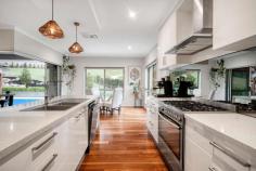  29 Ballara Drive West Wodonga VIC 3690 $1,259,000 Welcome to 29 Ballara Drive, West Wodonga! This stunning property offers a perfect blend of comfort, style, and convenience. Situated on a generous 1669 sqm block (approx), this spacious 4-bedroom, 2-bathroom house is the epitome of modern living. Step inside and be greeted by a light-filled and open floor plan that seamlessly connects the living, dining, and kitchen areas and is complimented by hardwood spotted gum flooring. The well-appointed kitchen features sleek cabinetry, has waterfall stone bench tops, ample storage space, and top-of-the-line appliances, making it a dream for any home chef. The bedrooms are generously sized and offer plenty of natural light, creating a serene and relaxing atmosphere. The master bedroom boasts its own ensuite, providing a private sanctuary for the homeowners. The additional bathroom is beautifully designed and finished to the highest standards. A dedicated study nook takes in the beautiful outlook of the surrounding area. The fabulous all weather entertaining area with sparkling in-ground solar heated salt pool with additional relaxing Bali Hut is amazing and is complimented by a Jetmaster outdoor wood fireplace for those cosy nights in. Get the popcorn ready for the kids to enjoy the theatre room with state of the art projector system. This property also offers the convenience of a double garage, providing secure parking for two vehicles and an additional storage area off the garage. Extras include a solar hot water system, solar power system of 6.6kw, and an automated irrigation system to lawns and gardens. 