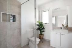  2/33 Genista Street Frankston South VIC 3199 $790,000 - $869,000 Step into a world of modern style and sophistication with this thoughtfully designed three-bedroom, two-bathroom residence, ideally situated within the prestigious Frankston High School zone. This property is tailor-made for those who crave low-maintenance living while savoring the luxury of a tranquil location. Upon entry, engineered wide-board timber flooring guides you through the ground floor, unveiling a stunning living and dining area that seamlessly connects to an entertainer's dream backyard. Slide open the glass doors to embrace the refreshing sea breeze and bask in the afternoon sun. The gourmet kitchen, tastefully appointed for any occasion, beckons with its stone benchtops and stainless steel appliances, including a gas cooktop and dishwasher-an ideal setup for both indoor and outdoor dining. Completing the ground floor is the master bedroom, complete with a walk-in robe and a private en-suite. Head upstairs to discover the well-arranged sleeping quarters, where two additional bedrooms with built-in robes await, along with a gleaming family bathroom. Additionally, there's a separate living room, perfect for providing the kids with their own space. Offering absolute privacy and a design that welcomes an abundance of natural light, this nearly-new townhouse defines contemporary coastal living. You'll also appreciate the convenience of a powder room on each level, split-system heating and cooling, low-maintenance outdoor areas, a garden shed, and a water tank. Strategically positioned to enjoy the best of Frankston's waterfront amenities and lifestyle, this property is just steps away from Beauty Park, Frankston's bustling CBD with its thriving entertainment district, public transportation options, and excellent schools. 