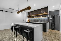  630 Koorlong Avenue Irymple VIC 3498 $749,000 - $823,000 Sales Agent and Marketing Specialist, Katrina Wootton of Ray White Mildura welcomes to this unique, industrial-inspired residence designed for those who appreciate a refined, contemporary lifestyle. This luxurious 3-bedroom, 2-bathroom home offers the perfect blend of sophistication and functionality, making it the ideal haven for professionals, young couples, small families, singles, retirees and first home buyers alike. Upon entering, be captivated by the polished exposed aggregate concrete flooring, high square set ceilings and impressive study nook, secluded behind charming barn doors. The heart of the home is a spacious, open plan kitchen, dining, and living room, complete with stunning a Venetian plaster feature wall. The kitchen itself boasts a magnificent intense white Caeser-stone waterfall island benchtop, induction cooktop with integrated range hood, a chic pendant light, and a generously-sized butler's pantry with sink and dishwasher, ensuring you have ample space to store and prepare culinary delights. The master suite is truly a retreat, offering access to the rear yard, an open walk-in robe and a sleek ensuite with a walk-in shower. Reverse cycle heating and cooling ensure year-round comfort, while the large sliding stacker door invites you to step out into the alfresco area, complete with a built-in fireplace and barbecue - perfect for entertaining or simply relaxing in your own private sanctuary. A 5.2kW solar system, automatic front gates for added security, a double garage, and a low maintenance yard round out the features of this remarkable property. Set on a 395 square metre block, this elegant townhouse has it all, combining an elegant industrial aesthetic with the practicality and convenience modern living demands. Don't miss the opportunity to make this exceptional residence your own. Act quickly and secure a viewing today! 