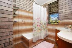  13 Copra Crescent Karama NT 0812 $450,000 Arriving at this home, you are greeted by the most glorious, lush, tropical gardens. Lovingly cared for, these well-established gardens are simply a joy to behold. You'll see an ample lawn to the front and the rear garden is vast making for a dream family enclave. With parking for 2 cars, step inside the cool of this solid brick home. Entering the bright living space, you will be struck by the high ceilings and immaculate order of this property. While there is potential to modernise this space, it is in move in condition and prepared to host family life. The open plan living and dining area adjoins the neat kitchen, all with views to the beautiful rear garden. The kitchen is perfectly positioned to oversee any smaller family member's activities, both indoor and out. From the living area, sliding doors lead to a peaceful verandah extending the length of the home. Great for dining or just relaxation and overlooking the stunning lawn. Stepping back inside, we visit the first of three bedrooms. This room with built in robe, ceiling fan and air-conditioning offers the perfect position to function as a work from home space or study. Bedroom two is similarly appointed and sits opposite the main family bathroom. While this bathroom boasts original features and a separate WC, you will see potential to add your personal touch here. The master suite is bright and airy, with generous proportions, built in robes and ensuite. The laundry is conveniently located next to the main bathroom and offers its own entrance to the garden, giving easy access to the paved drying area with Hills Hoist. Just moments from the Casuarina Shopping Hub and close to university and hospital, this original owner-occupied home is primed to become a much-loved family residence. 