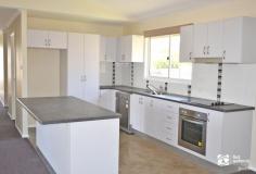  Unit 8/7 Gregory Ct Biloela QLD 4715 $275,000 Welcome to an exceptional investment opportunity situated in a quiet cul-de-sac, featuring a reliable long-term corporate tenant who contributes $430 per week. This alluring 4-bedroom, 2-bathroom residence is nestled within landscaped surroundings and includes access to a shared in-ground pool. The property is fitted with split system air conditioning units for maximum comfort, with three bedrooms offering convenient built-in cupboards, while the fourth bedroom boasts a spacious walk-in robe. All four bedrooms are equipped with ceiling fans, and the master bedroom includes a well-appointed ensuite. The interior design maximizes space, offering an open and inviting layout that combines the lounge, dining area, and a stylish kitchen complete with a breakfast bar and a convenient office nook. The living space seamlessly extends to a timber deck that provides a picturesque rural view. As a bonus, the driveway leads to a double carport, and there is extra storage space available underneath the house. 
