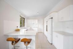  90 Lynches Road Armidale NSW 2350 $499,000 Conveniently located in a sought after south hill area, 90 Lynches Road is comprised of a three bedroom brick and tile home on a level and fully fenced 974 sqm block. The open plan kitchen living and dining area entertains a north facing aspect and in complete with wood heating reverse cycle air and a gas outlet. Large vertical windows allow for ample light creating a comfortable and free flowing area throughout the day. Recently updated, the kitchen offers a timeless neutral colour palette, with stainless steel appliances, a pantry and a breakfast sitting area with easy maintenance tile floors underfoot. Three bedrooms are finished with carpets and the master and second bedroom are home to built in robes. A single bathroom provides a shower, bath, vanity and separate toilet and the laundry includes storage, sink and external access to the yard. Outside the fully fenced yard offers neat and tidy gardens, a covered sitting area, and single lock up garage with a formed cement driveway. Neat as a pin and as complete as they come, this home is a true walk right in and sit right down prospect. With the backing of a sought after, family friendly and convenient location. 