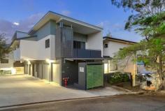  30 Jordan St Greenslopes QLD 4120 Discover the essence of chic city-fringing living in this New York loft-style property, beautifully set across two distinct levels. Close to leafy parklands and local conveniences, this three-bedroom residence is ideal for buyers, downsizers and investors alike. Showcasing elegant tiled floors and a versatile neutral colour palette, a spacious open-plan living and dining area greets you upon entry. Illuminated by a large void, this ground-level central space spills out onto a partially-covered balcony with serene suburban views. This brilliant al fresco area promises to be the setting of many cherished gatherings. There is also an immaculate kitchen benefitting from a tiled splashback, quality appliances and ample cupboard storage. Upstairs, an open mezzanine-style study looks out over the central living area below. Accompanying this versatile space, an ensuited master bedroom has a walk-in robe. Two additional bedrooms encompassing built-in robes are downstairs, along with a well-appointed main bathroom featuring laundry facilities. For your comfort, the apartment is fitted with air-conditioning and ceiling fans throughout. An added bonus is the secure side-by-side parking for two vehicles, coupled with extra storage space. Minutes from the city-bound Ipswich Road and the South East Busway, this fantastic property is near Thompson Estate Reserve’s playgrounds and Stones Corner’s attractions. The Gold Coast-bound Pacific Motorway and the Fairfield train station are also easily accessible from this address. Additionally, medical-workers will value the residence’s proximity to the Greenslopes Private, Princess Alexandra, Mater and Queensland Children’s hospitals. Falling within the Greenslopes State School and Cavendish Road State High School catchment areas, this superb apartment is a short distance from Saint Joachim’s Primary School, Mary Immaculate Primary School and Our Lady’s College. Do not delay – call to arrange an inspection today. 