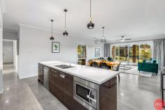  43 Rosehill Place Branxton NSW 2335 $1.35 mil to $1.45 mil Nestled on a 3.75 acre block sits this exquisite well-maintained home in the ever-popular suburb of Branxton. Being only a short 10 minute drive to Maitland or Singleton and under an hour to Newcastle, you are tucked away in a peaceful location while still close to major suburbs. Branxton sits in the heart of the wineries and restaurants of the Hunter Valley. Are you in search of a rare, high-quality home? Look no further; this home is tailor-made for you. Properties in this tranquil cul-de-sac rarely become available. It's designed to impress even the most discerning buyers, boasting abundant natural light, LED lighting, tiled floors throughout the main living spaces, plush carpets in all the bedrooms, and split system air conditioning and ceiling fans to keep you comfortable year-round. The modern gourmet kitchen is highlighted, featuring sleek stone countertops, a gas stove, an electric oven, pantry, ample storage, stylish downlights, and an inviting island bench. This home was crafted for luxurious living, offering an open-plan family living area that seamlessly connects to the outdoor alfresco area through glass sliding doors. All four bedrooms are well-appointed, with the master suite standing out, thanks to its generously sized walk-in wardrobe and full-sized ensuite. The ensuite has a toilet, dual basins, and a spacious shower cleverly positioned away from the other bedrooms, making it ideal for anyone working irregular shifts. Stepping outside through the perfectly placed sliding doors, you'll find this spacious alfresco and outdoor entertainment areas equipped with ceiling fans and downlights, a productive olive grove and fruit trees, a vegetable garden and landscaped grounds. With its generous land size, this property offers endless opportunities for outdoor enjoyment, versatility, and space for the whole family to enjoy. Don't wait, call Cathy and her team today for more information or to book an inspection. Whilst all care has been taken preparing this advertisement and the information contained herein has been obtained from sources, we believe to be reliable, PRDnationwide Hunter Valley does not warrant, represent or guarantee the accuracy, adequacy, or completeness of the information. PRDnationwide Hunter Valley accepts no liability for any loss or damage (whether caused by negligence or not) resulting from reliance on this information, and potential purchasers should make their own investigations before purchasing. 