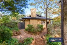  810 Stevens St Mundaring WA 6073 $799,000 This fantastic family home with a central Mundaring address caters to kids of all ages, parents who love entertaining and pets. Multiple living zones and a separate junior wing give everyone ample room to do their own thing. A stretch of outdoor entertaining space with a showstopping table for eighteen, a fire pit and a verandah twined with wisteria offers alfresco dining for much of the year. 5 bedrooms, 2 bathrooms Brick and Iron, fresh décor Lounge with open fireplace O-plan kitchen/family/meals Separate jnr bedroom wing Fantastic outdoor living zone 3-phase pwd workshop 9 x 6 Veggies, fruit trees, chickens 2308 sqm lot with dual entry Steps from school and village Step inside and discover a versatile, family-friendly floorplan boasting five bedrooms – or the option to utilize one as a spacious, light-filled study – formal and informal living zones, and interiors awash with natural light thanks to a series of large corner windows. This home accommodates every aspect of your family’s dynamic lifestyle, delivering an impeccable balance of functionality and comfort and a welcoming nest for your nearest and dearest and the perfect venue for social celebrations. Fresh paint, new carpets and a new multi-zoned, reverse-cycle air conditioning system give the home an abundance of move-in appeal. Landscaped, reticulated gardens, a floodlit half-court with sprung court tiles, a workshop with 3-phase power and a separate drive-in entry mount a persuasive argument for embracing life in the Hills. Engineered timber floors extend throughout much of the plan, their soft honeyed tones washed with natural light and blending with the crisp white of the freshly painted walls. At the front of the home is a formal lounge with an open fireplace and an oversized main bedroom with a mirror-fronted walk-in robe and a fully tiled ensuite with a walk-in shower, vanity and WC. A central hall leads into an open plan family room, meals area and kitchen, the heart of the home with seamless access to the extensive outdoor living zone. The kitchen boasts a new dishwasher, a 4-burner gas hob and an electric oven. White cabinets set under a wide worktop with an integrated breakfast bar and a walk-in pantry provide ample storage. The junior bedroom wing sits off the central living zone and comprises a family bathroom, walk-through laundry, a separate WC and three carpeted bedrooms, two with built-in robes and each spacious enough for a queen-sized bed. This property’s family-focused design extends beyond the home to a fully fenced backyard with lawn areas, a vegetable garden, and numerous fruit trees. The star of this impressive alfresco living zone is a massive table crafted from an upturned tree root topped with glass set under a noble oak tree. A firepit and a stone-topped bench fitted with a bar fridge hint at a future featuring memorable family celebrations, impromptu alfresco dinners and sleepovers of a spectacular standard. A second driveway accesses the chicken coop and workshop. The workshop boasts a lean-to and an enclosed tool shed. A concrete apron makes for easy manoeuvring, and there is plenty of space to park a trailer or boat. Mere steps from Mundaring Primary School and a short walk from Mundaring Christian College and the bustling Mundaring village, this home puts your family at the centre of all the Perth Hills have to offer. Sporting facilities, kilometres of walking and riding along the Heritage Trail, government and independent schools and excellent access to the airport, Midland and the Perth CBD are all on the doorstep, yet feel a world away. 