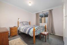  90 Lynches Road Armidale NSW 2350 $499,000 Conveniently located in a sought after south hill area, 90 Lynches Road is comprised of a three bedroom brick and tile home on a level and fully fenced 974 sqm block. The open plan kitchen living and dining area entertains a north facing aspect and in complete with wood heating reverse cycle air and a gas outlet. Large vertical windows allow for ample light creating a comfortable and free flowing area throughout the day. Recently updated, the kitchen offers a timeless neutral colour palette, with stainless steel appliances, a pantry and a breakfast sitting area with easy maintenance tile floors underfoot. Three bedrooms are finished with carpets and the master and second bedroom are home to built in robes. A single bathroom provides a shower, bath, vanity and separate toilet and the laundry includes storage, sink and external access to the yard. Outside the fully fenced yard offers neat and tidy gardens, a covered sitting area, and single lock up garage with a formed cement driveway. Neat as a pin and as complete as they come, this home is a true walk right in and sit right down prospect. With the backing of a sought after, family friendly and convenient location. 