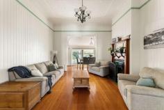  95 Hows Road Nundah QLD 4012 Situated on a beautiful flat 908sqm North-facing parcel of land in one of Brisbane's fastest-emerging markets, 95 Hows Road gives the incoming purchaser an array of options, whether that be to simply move in and enjoy the vast character features that this beautiful late 1800's home has to offer, raise and renovate or explore further development potential (STCA). 'Minerva' was one of the original farm houses in Brisbane and was once the site of the first commercial pineapple farm in Australia. Dating back to approximately 1888*, the home retains many of the gorgeous original features including pressed metal ceilings, beautiful double-sided brick fireplace (working), polished timber floorboards and original VJ's. The 19.4m North frontage facilitates a genuine sense of grandeur from the street with the ornate features of the home immediately evident from the first look. The wide frontage, bull-nose roof, lattice gate and feature balustrading are just a small sample of the extensive pre-war character charm that has been preserved throughout the home. Through the front door, soaring ceilings provide for a stunning volume to the upstairs portion of the home, with the central atrium living room also boasting a beautiful double-sided brick fireplace which creates a stunning ambience. The separate dining is adjacent to the renovated kitchen which leads through to the large family room. The three upstairs bedrooms are all of a generous size with two even consisting of "sleep-outs" which double as dressing rooms. The bathroom is also presented in beautiful condition and is decorated with gorgeous timber blended with a timeless black and white theme. Downstairs, there is a huge amount of space that can be used for an array of purposes, whether storage, rumpus or home office. The back yard is a highlight of the home with 52m of depth in the block and endless potential for extension, pool or any number of other options. Despite the wide frontage of the home itself, access to the rear is easy, which assists greatly in any further works to be conducted. Further features of this incredible property include: Vast array of character features throughout Air-conditioning and ceiling fans in bedrooms and family room Stunning indoor and outdoor entertaining spaces Moments from Nundah Village, ample transport and schooling options and the airport 