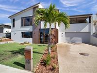  43 Sharp Street RURAL VIEW QLD 4740 $899,000 This entertainer's delight is a one-of-a-kind property that truly has it all. With its exceptional design, luxurious features, and stunning location, you'll never want to leave. Definitely not exaggerating when we stay it's like something out of a house and garden magazine. The vibe is tropical, relaxing and will certainly have you feeling like you're in paradise. If you're someone who loves to entertain guests, this home is perfect for you - the kitchen will ensure you're preparing meals like a MasterChef and the butlers pantry set with an abundance of extra storage. Not only does it have a stunning pool in the middle of the home, but the open-plan layout and bifold doors create a seamless indoor-outdoor living experience. You can enjoy the fresh sea breeze and soak up the warm sun while relaxing in the comfort of your own home. The master bedroom is a true oasis, with an oversized layout and a dreamy ensuite that will make you feel like you're staying at a luxurious resort. The attention to detail and quality craftsmanship is evident throughout the home, ensuring that every inch of the property is beautiful and functional. In addition to the stunning features of the home, you'll also be able to enjoy breathtaking views of the ocean looking through to Dolphin Heads. Whether you're sitting on the deck with a cup of coffee or taking a dip in the pool, you'll be able to soak up the natural beauty of the area. The night lights on the surrounding hills will be a special treat as the sun sets and it's time to immerse yourself in the lifestyle on offer. 