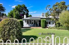  30 Adelaide Street Wentworth NSW 2648 $299,000 - $328,000 Situated in one of Wentworth's quietest and most desirable neighborhoods is this strikingly beautiful home located on 1/4 acre (1,012m2). The three bedroom, one bathroom conite home is immaculately presented throughout. From the moment you walk in the front gate you will be amazed by the manicured gardens (both front and back under auto sprinklers) and the large front patio with ceiling fan, ideal for relaxing while enjoying the colourful front garden. Functional kitchen with meals area, plus separate lounge, along with gas heating and ducted evaporative cooling. All three bedrooms offer built-in-robes plus built in dresser in the master, ceiling fan and ducted air conditioning. The sunroom would make the ideal second living space or teenagers retreat. Two toilets, one indoors and another conveniently located near the laundry. The fantastic inclusions continue in the fully fenced rear yard. Double tandem carport with auto roller door & paved undercover BBQ area for entertaining guests. Large purpose-built workshop shedding with ample power points and roller door access, with additional under-cover storage adjacent to the shed, suitable for another vehicle. Backyard access is provided through the rear lane (plus the side access through the carport), solar panels to help keep your power bills lower and an assortment of fruit trees in your own orchard. You'll never pay late fees ever again as you are literally next door to the Wentworth Library. Within walking distance to the riverfront, Junction area, Wentworth's central business district, cafes & pubs, local supermarket, library, swimming pool, bus stops, sporting facilities and so much more. With a rental appraisal of $330 - $350 per week. This wonderful home packs a powerful punch! 