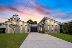  14 Haggerty Cl Narara NSW 2250 Designed to make a statement, this impressive, supersized family home offers an exceptional sense of style and space while being set in a super convenient location. Spread across an expansive single-level design, the original classic home has undergone an inspired renovation and transformation. Completely reconfigured to cater to modern family needs while integrating an architectural indulgent design. From the moment you step into the designated foyer, you will be greeted with soaring raked ceilings offering an abundance of natural light, complementing the updated contemporary interiors and fresh modern neutral colour palette throughout. An enticing floorplan encompasses a selection of formal and informal living zones, a stunning chic-gourmet kitchen, palatial private parents’ quarters, and seamless indoor/outdoor flow. Perfectly set with a lush natural back drop – reserve at the rear. If you’ve been looking for a dream home offering a combination of style, location, and lifestyle, this property is a must for you to inspect! Features include: – Quality-built residence with striking street appeal, occupying a 643sqm level sun-drenched parcel of land in a peaceful cul-de-sac, centrally located to all conveniences. – Sparkling fresh interiors spread across an expansive single level, unified by a sleek contemporary colour palette and luxe fittings and finishes throughout. A versatile floor plan offers a brilliant opportunity for multigenerational living. – Four generously proportioned bedrooms in total, with a versatile combination including: + Master bedroom with walk-in robe + ensuite striking full-sized bathroom with freestanding bath + dual shower heads. + Palatial private parents’ quarters with separate sitting area, walk-in robe/dressing room, and ensuite with double basin vanity. – Chic gourmet kitchen offering an abundance of storage space + a separate butler’s pantry, a 900mm freestanding oven with a natural gas cooktop, a huge island bench with a designated breakfast bar, and a brilliant servery window. Sitting in the heart of the home, spilling seamlessly onto the expansive alfresco entertaining deck, and looking across to the beautiful treescape backdrop. – Multiple living areas offer many options – the ultimate in space for the whole family plus any extras when entertaining. A combination of formal and informal living areas, all of which flow seamlessly to the outdoor alfresco entertaining deck, and an additional designated media room or office set up. – Total outdoor package: expansive entertaining deck overlooking the fully fenced rear yard, lush soft grass, and plenty of room to add in a plungy pool if you like (STCA). The front yard is huge and softly grassed, making this another great space for the kids and pets to play (picture a beautiful front fence and sliding gate installed). Wow, this is a real family entertainment package. – Off-street parking is plentiful, with a designated area at the door and ample driveway space for all the extras—boats, caravans, trailers, etc.—and additional extra storage and a workshop area behind the roller door. – Solar panels x 27 panels, 8kw, brilliant big money saver. Extras: NBN Connected, three reverse-cycle air conditioners, ceiling fans, LED lighting, abundance of storage throughout, 4000L water tank. Picture perfect from every angle; this is the kind of property that would be, with every detail thoughtfully taken care of. This in-demand address is all set in an incredibly convenient location, offering easy access to an array of schools, buses and trains, Gosford CBD, the waterfront, cafes, and hospitals. For commuters, it’s a few minutes’ walk to Narara station and easy access to the M1 for access to Sydney and Newcastle, along with the University of Newcastle’s (Ourimbah Campus) Westfield Tuggerah and Erina Fair, all within 15 minutes. Adding to all of this is a selection of beautiful beaches and bushwalks, all within 20 minutes. 