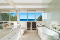  15 Kallaroo Street Corlette NSW 2315 $2,400,000 Situated a short 300m walk away from the glistening shores of Corlette Beach, this exquisite house offers a truly enviable beachside lifestyle. With a perfect northern orientation, the architecturally designed and quality-built home bathes in natural sunlight and enjoys refreshing ocean breezes year-round whilst providing the opportunity to live on the one level. The striking modern exterior hints at the modern luxury and comfort that awaits within. As you step inside, you are immediately drawn to the captivating water views that beckon through expansive and carefully placed array of glass windows and doors. Greeted by the warmth of timber flooring throughout, the neutral interiors create a soothing ambiance that complements the coastal surroundings. The heart of the home boasts a sleek kitchen adorned with crisp & modern cabinetry, quality stone benchtops and cooktop. Miele appliances make cooking a pleasure, while the timeless, open layout ensures seamless interaction with guests and family. The master suite and garage is also located on the main floor allowing you the opportunity to live all on the one level. The balcony presents an ideal setting for entertaining, where you can soak in the views while hosting gatherings, enjoying a morning cup of coffee and book or simply unwinding after a fun-filled day at the beach. This thoughtfully designed home accommodates four spacious bedrooms, each designed with comfort in mind plus a study. The residence also offers a second living room downstairs which could also be used as a fifth bedroom. The main bedroom, a true retreat, treats you to expansive water views and features a private ensuite adorned with a large bath that invites you to indulge in a relaxing soak after a long day. Modern elegance meets practicality with the addition of a generous storage area on the lower level, providing ample space for your belongings. Whether you're looking to store beach gear or household items, this feature adds a layer of convenience to daily living. In addition to this, a double remote garage provides secure parking for your vehicles. Other features include the 'Green Credentials', the perfect northern aspect of the home in conjunction with an efficient 'Rheem Heat Pump' Hot Water System meaning that the home requires less electricity to be used, therefore your electricity bills are kept to a minimum. Outside, the established, easy cared gardens offer a serene backdrop, inviting you to connect with nature. The property's unique positioning, backing onto a reserve, ensures a peaceful and uninterrupted outlook, allowing you to revel in a sense of tranquillity that's truly rare. Experience the epitome of coastal living in a location that combines proximity to the beach with the tranquillity of reserve-backed living. This house offers not just a home, but a lifestyle-one where every day is a beach vacation and where the comforts of modern living merge seamlessly with the beauty of nature. Do not delay or you will be disappointed. Please contact Dane Queenan on 0412 351 819, Tristan Esquilant on 0435 642 942 or Erin Sharp on 0400 560 067 to receive a full information package including recent sales, rental appraisals, pest & building inspection reports and contract for sale. 