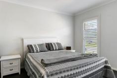  4 Lochinvar Dr Bundanoon NSW 2578 $1,325,000 A surprisingly sizeable weatherboard residence with a pretty facade, perfect for the growing family or when needing in-law accommodation. The floorplan allows for excellent separation between the master wing and family/guest wing. An extremely versatile floor plan in a 5-star locality. High points The master wing offers a generous ensuite, walk-in robe and intimate TV room or work from home space if needed and separated from other beds by the well positioned, centrally located kitchen/dining/family area. The family/guest wing at the rear of the residence houses a further 4 bedrooms, all doubles with built-in robes plus the main bathroom with separate wc and all accessed via another TV/games room. The kitchen/family space is bathed in sunshine via highlight windows and showcases a stunning galley kitchen with stone benchtops, oversized island, quality appliances and walk-in pantry and offers a seamless flow to the outdoor entertaining terrace under roof. Beautifully appointed throughout with a neutral colour palette and light filled living spaces, further enhanced via the 9ft ceilings, this home will appeal to many buyers in today’s market. Excellent storage options with built-in cabinetry in the laundry and double linen cupboard in the hallway. An added convenience is all town services, water tank reticulated to garden, toilets and laundry plus ducted a/c throughout. The home also offers an oversized garage with internal access and auto panel lift door, a much needed convenience, plus garden shed and bike shed at the rear of the property. Excellent location with direct access to the park, pool, oval and Club or an easy level walk to the village centre. Well fenced and easy care gardens with hedging in place to ensure privacy in the future. 