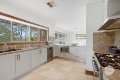  22A Neville Street Oatley NSW 2223 $2,600,000 Discover the allure of this sophisticated residence, perfectly positioned in a highly coveted street, just moments away from schools, parks, the train station, and the vibrant Oatley Village. Embraced by a captivating exterior, this refined brick home offers a spacious retreat for families, with generous proportions and a secluded leafy backdrop creating an inviting haven. Numerous living spaces provide a spectrum of entertainment possibilities. Host memorable dinner parties in the formal lounge and dining area which seamlessly flow into the open-plan family room from the well-appointed kitchen. Enjoy elevated leafy vistas and direct access to the outdoor dining area, creating a cozy and relaxed space for casual living and dining. The four generously sized bedrooms, all with built-in robes, cater to comfort. The master bedroom presents the epitome of luxury. Revel in a spacious walk-in robe, an elegant ensuite, and direct access to a private, north-facing courtyard. An additional study adds practicality for those who work from home. The gourmet kitchen seamlessly combines size, elegance, and functionality, featuring high-quality appliances, a beautiful stone countertop, gas cooking, and a practical island with seating. Both bathrooms showcase sleek, premium finishes, and an extra powder room adds convenience for guests. On the lower level, discover an additional lounge room with direct backyard access, offering versatility and an excellent extra space for growing families. While outdoors you can indulge in the expansive entertainer's decks, a flat grassed yard, stunning timber floors, and an oversized double garage with internal access. This home, with its sought-after features, is the fresh start you've been eagerly anticipating. Key Features: - 4 generously sized bedrooms with built-in robes, master with walk-in robe & ensuite - Multiple layout options for harmonious living for the growing family - Stunning elevated district views with a private leafy outlook - Two expansive entertainer decks & a flat grassed yard - Ultra-convenient location within walking distance to shops, schools, parks & transport 