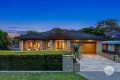  22A Neville Street Oatley NSW 2223 $2,600,000 Discover the allure of this sophisticated residence, perfectly positioned in a highly coveted street, just moments away from schools, parks, the train station, and the vibrant Oatley Village. Embraced by a captivating exterior, this refined brick home offers a spacious retreat for families, with generous proportions and a secluded leafy backdrop creating an inviting haven. Numerous living spaces provide a spectrum of entertainment possibilities. Host memorable dinner parties in the formal lounge and dining area which seamlessly flow into the open-plan family room from the well-appointed kitchen. Enjoy elevated leafy vistas and direct access to the outdoor dining area, creating a cozy and relaxed space for casual living and dining. The four generously sized bedrooms, all with built-in robes, cater to comfort. The master bedroom presents the epitome of luxury. Revel in a spacious walk-in robe, an elegant ensuite, and direct access to a private, north-facing courtyard. An additional study adds practicality for those who work from home. The gourmet kitchen seamlessly combines size, elegance, and functionality, featuring high-quality appliances, a beautiful stone countertop, gas cooking, and a practical island with seating. Both bathrooms showcase sleek, premium finishes, and an extra powder room adds convenience for guests. On the lower level, discover an additional lounge room with direct backyard access, offering versatility and an excellent extra space for growing families. While outdoors you can indulge in the expansive entertainer's decks, a flat grassed yard, stunning timber floors, and an oversized double garage with internal access. This home, with its sought-after features, is the fresh start you've been eagerly anticipating. Key Features: - 4 generously sized bedrooms with built-in robes, master with walk-in robe & ensuite - Multiple layout options for harmonious living for the growing family - Stunning elevated district views with a private leafy outlook - Two expansive entertainer decks & a flat grassed yard - Ultra-convenient location within walking distance to shops, schools, parks & transport 