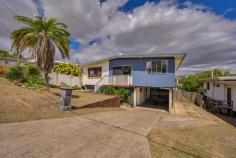  31 Wilson Street New Auckland QLD 4680 $365,000 Boasting picturesque views of Mt. Larcom and the surrounding suburb, this immaculate four-bedroom, two-bathroom residence epitomises elevated living. Recently renovated, this home, crafted in 1975, graces a fully fenced 612m2 parcel of land. Upon entry, you'll be welcomed by a capacious, open-concept living space adorned with rich timber-look flooring and a tasteful, neutral colour palette. Abundant windows and doors facilitate refreshing cross-ventilation. The galley-style kitchen, situated towards the rear, offers ample storage and is equipped with state-of-the-art stainless-steel appliances for added convenience. The air-conditioned master suite is a sanctuary of comfort, featuring its own contemporary ensuite, newly fitted carpets, built-in robes, and a ceiling-mounted projector. The remaining three bedrooms also offer split-system air-conditioning, plush carpets, ceiling fans, and built-in cupboards. A generously sized bathroom with a shower, vanity, and a separate bath completes the upper level. On the lower level, a well-appointed workshop area, laundry facilities, a tiled and lockable office, along with tandem two-car accommodation with convenient drive-through access to the backyard, provide an abundance of practical spaces. Additional storage space can be found beneath the subfloor of the residence. This property also boasts side access, affording the opportunity to add a shed or pool to further enhance its appeal. Key Features: • 	 Year Built: 1975 • 	 Land Size: 612m2 with full fencing • 	 Expansive open-plan living and dining areas • 	 Galley-style kitchen with electric appliances • 	 Master suite with contemporary ensuite, A/C, projector, built-in robes • 	 Three additional bedrooms with plush carpets, fans, A/C, and built-in cupboards • 	 Main bathroom features bath, shower, and vanity • 	 Lower level offers workshop, laundry, and a separate lockable office with tiled flooring • 	 Subfloor storage space • 	 Tandem two-car garage with drive-through access to the backyard • 	 Side access with room for a shed or pool • 	 Approximate annual rates: $3600 • 	 Rental appraisal: $420 to $450 per week • 	 For more information contact the marketing agent Ben Crick on 0487 123 288. 
