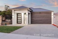  11 Hillcrest Road Kewdale WA 6105 $819,000 Take advantage of endless space with this beautiful four bedroom, three-bathroom family home, located in a desirable pocket of Kewdale. You'll love the soaring high ceilings, the open plan layout and the premium finishes throughout this residence. Positioned just moments from renowned schools and Belmont forum, a convenient lifestyle awaits! Set on a quiet family-friendly street, the modern facade of this home makes a strong introduction. The home opens onto soaring high ceilings and stylish tiled flooring which provides an immediate sense of space. The spacious master suite is positioned at the front of the residence and is complete with built-in robes and a modern ensuite, delivering an excellent platform for a parental retreat. A focal point of the home is the open plan kitchen, living and dining room, this space is fantastic for family togetherness. The gourmet kitchen is beautifully designed with stone benchtops, a scullery and lots of cupboard space. The rear wing of the home features three well sized bedrooms including a guest suite, as well as two bathrooms. Transitioning from indoor to outdoor living, an alfresco and low-maintenance backyard provide an excellent setting to enjoy summer days with family and friends. Contact Michael Keil today to register your interest! Property Features: ● Modern façade  ● Large front door  ● Informal lounge upon entry  ● Double lock up garage with manual roller door for side access  ● Master suite with built in robes and en-suite with vanity with stone bench top, separate WC and shower  ● Inner courtyard  ● Study or potential fifth bedroom  ● Open plan kitchen, living and dining  ● Gourmet kitchen with stone bench tops with waterfall edges, scullery, walk in pantry, undermount sink, premium appliances, lots of cabinetry and glass splashback  ● Concrete side yard  ● Spacious laundry and adjoining outdoor line area  ● Two well-sized secondary bedrooms both with robes  ● Elegant primary bathroom  ● Guest suite positioned at the rear complete with built in robe and en-suite as well as access to the alfresco  ● Rear alfresco with low maintenance synthetic turf  ● Elegant tiled flooring throughout  ● Ducted reverse cycle air conditioning  ● Recessed ceilings  ● Security system  ● 442 sqm Green Title block  ● Water Rates: $1,501.89 pa  ● Council Rates: $2,310.72 pa. 