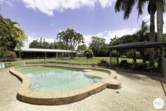  972 Mackay-Eungella Road Pleystowe QLD 4741 Where can you find the size of acreage fronting to the river with access for your canoes and boats or just go for a swim, fish or visit your own pet platypus or BBQ on the waterfront. What a glorious lifestyle of 4 large bedrooms, built-in robes and air-conditioned throughout. The ensuite and bathroom has been fitted out beautifully to make it a pleasure to live in, as is the large laundry that is located in a position perfectly to look out over the beautiful lawns and pool and to keep noise away from the living and television areas. The 2 living areas are large in size having a formal lounge and dining room plus casual family room dining and living area leading onto the outside entertainment areas. The Kitchen has been designed with style and completely fitted out to the glory of anyone who enjoys preparing food or entertaining. The inground pool is a delight to entertain around as it is a short distance from the balcony looking towards the river. There is also a granny flat fully fitted out located near the pool. The shed is spacious enough to accommodate 7 cars with one bay being of high clearance for caravans, boats or other larger items. But as the saying goes there's more! A very large solar system ,generator installed and 3 rainwater tanks all on beautifully groomed 1.6 acres (approx), not on your title but there is another approx 1.25 acres of riverfront verge. 