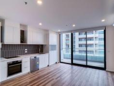  1008/2 Gribble Street Gungahlin ACT 2912 $430,000+ Imagine spending summer at a rooftop barbecue overlooking Yerrabi Pond, or completing languid laps in a 20-metre resort-style pool. Be spoilt for choice with shared amenities that also include an onsite gym when you snap up this stylish apartment in the Jade complex at Gungahlin. Flaunting stylish finishes including timber floors to the living areas and large-format tiles to the bathroom, apartment number 1008 also benefits from a generous covered balcony that has ample room for an outdoor table. The sleek central kitchen features stone benchtops, an induction cooktop, microwave niche and excellent storage, while additional storage can be found at the entry, with a full-length coat closet, and in the basement storage cage. Two generous bedrooms have built-in wardrobes and a chic, well-designed shared bathroom also boasts a European-style laundry. This well-situated and secure apartment puts you a hair's breadth from Gungahlin Town Centre with the convenience of shopping, dining and easy access to light rail. Also just a short drive to the CBD, ANU and UC, making it the ideal first home or investment property. Features include: • 	 10th floor as-new apartment in Jade complex • 	 EER of 6.0 • 	 Recently tenanted for $520pw • 	 Vacant possession available • 	 Modern kitchen with stainless-steel appliances • 	 Quality timber floors to kitchen/dining • 	 Carpet to bedrooms • 	 Covered balcony • 	 Split-system heating and cooling • 	 Stylish bathroom with face-level hidden storage and generous shower • 	 Intercom and lift access • 	 Secure basement car space • 	 Facilities include swimming pool, gym, pizza oven and BBQ area.. 