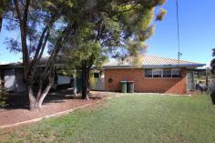  38 Lawrence Street Biloela QLD 4715 $279,000 If you're looking for a solid home to move into before Christmas, you'll need to be quick. Situated in a sought-after neighbourhood, this low set brick home backs onto vacant land and is only a 5* minute walk to Schools. Features include an air-conditioned living room which flows through to a spacious kitchen and dining room, complete with ample storage, a dishwasher and access to the under covered patio. Four bedrooms, three with built-in wardrobes and ceiling fans. The master bedroom is air-conditioned. The family bathroom has a shower over bath and a separate toilet off the laundry. The 900sqm allotment is fenced, ensuring security for your children and pets and has an external under covered entertainment area. There is also a double under covered carport with an enclosed storeroom. 
