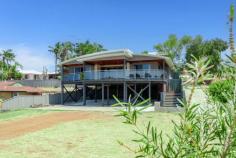  76A Janis St Halls Head WA 6210 $649,000 This charming, ultra-modern 'Pole' home would be an absolute gem of a holiday house for the lucky buyer. Situated between 'Blue Bay' and 'Doddies' beach, overlooking the kangaroo reserve in 'Old Halls Head,' this unique, 'one-of-a-kind' home has been both a beloved permanent residence and a holiday rental property. The low-maintenance property comprises three extra-large bedrooms, all equipped with mirrored built-in robes. The main bathroom and ensuite exude style with modern tiles reaching the ceilings, contemporary decor, basins, and tapware. The massive theatre room is spacious enough to accommodate extra sofa beds for additional guests. The kitchen is exquisite, boasting a large oval-shaped breakfast bar, ample storage, a microwave recess, dishwasher, and a stainless steel 90cm free-standing oven. The expansive open-plan living area features solid Marri floors, skirting boards, and bi-folding doors that open onto a curved, elevated, spacious balcony deck with a glass balustrade, offering views of the kiddies park and kangaroo sanctuary. Additionally, there's a sizable storage room off the back laundry and another deck area at the rear with retained garden beds. Beneath the home, there's ample parking space for at least six cars/boats/vans and plenty of extra storage. All within walking distance of the town center and golf club, this truly is a holiday paradise. This unique property exudes quality and charm, making you the envy of all your friends. For details or to arrange an inspection, call Greg Kent on 0409 920 042. 