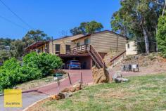  38 Nangana Way Kalamunda WA 6076 $849,000 Have you been looking to buy a home in Kalamunda with some views, but finding they are either too expensive or gone too damn fast!? Well welcome to 38 Nangana Way Kalamunda. Perched high up in a Cul-de-sac location you will be pleasantly surprised by the sound of cascading water and a multitude of birds singing in the background. The spacious 4 bedroom 2 Bathroom home features large living areas with cathedral ceilings, exposed beams, central kitchen meals and double bedrooms all with built in robes. Outside from the balcony you can watch the planes take off into the sunset whilst sipping on a champagne as you listen to the sounds of nature far away from the hustle an bustle of the world. Downstairs you have a double carport as well as plenty of parking and a huge workshop for those that like to potter. So if you aren't afraid of a little hard work and would like the opportunity to buy in the sought after Kalamunda Hills area at a bargain price, call Simon today and arrange a private viewing or pop in to the home open this weekend. Features Include: • 4 Bedroom 2 Bathroom Home • Formal Lounge with Cathedral Ceilings • Large Family Room • Central Kitchen Meals • Rumpus Room of Minor Bedrooms • Ducted & Split System Air Conditioning • Balcony with Great Views • Swimming Pool • Double Carport • Huge Powered Workshop • Cul-de-sac Location Built 1985 on a 2615sqm Block 