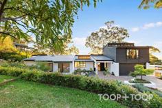  18 Teringie Drive Teringie SA 5072 Extensively renovated where no expense has been spared, this beautiful residence sprawls across approximately 3,071 SQM of pristine land. Step through the front doors across the beautifully laid, herringbone floors and soak in luxury surrounds and sparkling city views. Showcasing a designer JAG kitchen with dual wine fridge, stone bench tops, integrated fridge and freezer plus the must have butlers pantry with a second, brushed aluminum sink paired with a 900ml dishwasher all tucked away to encompass that clean lined look. Refined via every angle and designed to entertain seamlessly from the outside in, enjoy added creature comforts such as a gas strut server window to slide those canapés and cocktails out to entice your guests as they gaze across to those million dollar views. Enjoy the sunset with friends and family across the exquisite deck that leads across to a tiled, sunken fire pit where chatting into the night whilst watching the sun set is the ultimate core memory maker. You will adore coming home everyday to uninterrupted perfection from the master bedroom complete with a walk in wardrobe fitted with JAG joinery, an oversized ensuite with floor to ceiling tiles, dual vanities and a freestanding bath where you can soak the day away, bubbles in hand - Bliss. The home offers a separate powder room for added convenience complete with JAG cabinetry plus the use of a beautifully appointed main bathroom with floor to ceiling tiles, skylight with sweeping fluffy cloud views and top tier fixtures and fittings. Families will appreciate the newly created, oversized laundry with plentiful storage options and handy outdoor access, a thoughtful floor plan that works effortlessly with your busy life. The great outdoors offers a plethora of local wildlife that is grassed and fully fenced for children to play and enjoy viewing platforms to interact with nature. Enjoy the friendly pop in of the neighbouring koalas and passing kangaroo through a rear gate creating a tranquil sanctuary. Beautifully landscaped from the front of the house to the back complete with full water irrigation for peace of mind to keep everything looking pristine on the daily. You will love your peace and quiet but indulge in the fact that you are only a mere 7 minutes from Norwood, 4 minutes from local supermarkets and everything you need to complete your hills style living with spectacular views over Adelaide with local wineries that are an approximate 3 minutes drive away. Enjoy the tranquility of feeling like you are on top of the world yet you are only moments away from where you need to be for work life and school commitments with ease. Did we mention that there is an upstairs? Perfect for that family theatre room, work studio or the ultimate guest wing with wet bar and stone top to match downstairs. This glorious space offers views a neat and tidy balcony and the ultimate creative space to unleash what your heart desires. The entrance is close to the front door for the ultimate home office for clients to visit could be a great option to consider. This tucked away retreat also features brand new split system air conditioner, privacy blinds and external roller shutters. The dedicated dining space is fitted out with JAG cabinetry oozing space, style and seductive views. Each of the four bedrooms offer city views in volumes. For the environmentally friendly and those who love to save water - In this home you actually get to use it twice! How ? Because there is a brand new septic system that recycles the water and secretly waters your amazing garden whilst you sleep, so every dish you wash or every shower you take will actually be cleaning and using the water to irrigate your gardens so you never waste a drop. Is this the one that someone else is going to snap up and take away from you again? Or is the 4 minute drive to the world renowned, Penfolds Winery where you will take your friends to find the wine to celebrate or find the one you will use to commiserate. We look forward to welcoming you to the unique offering that will not last long where all you have to do is unpack, unwind and love your new found address. Features to love: Show stopping city to sea views across Adelaide Four spacious bedrooms plus study and upstairs retreat Aluminum bifold doors Large, double garage with storage James Hardie's Premium fibre cement decking Plunge pool complete with sweeping views across Adelaide Rear tool shed, concealing garden and pool equipment Tiled, sunken fire pit with views Herringbone floors laid over polished concrete flooring Luxury new carpet in all bedrooms and staircase Stunning master suite complete with ensuite and WIR Separate powder room Designer JAG kitchen with integrated fridge/freezer Top tier, 900 ML appliances with built in microwave Dual wine fridge and stone bench tops JAG cabinetry and joinery throughout the home Ducted and zoned, reverse cycle heating and cooling through out New LED lighting with mood lighting and slim line power points Upgraded circuit board and safety switches Fully fenced, grassed areas for children to play Garden reticulation across landscaped gardens Curious and cuddly wildlife at your doorstep Excellent proximity to St Peters' Girls School, St Ignatius, Pembroke and Rostrevor College. 