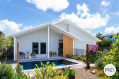 25 BEACH HOUSES ESTATE Agnes Water QLD 4677 $1,975,000 Welcome to 25 Beach Houses Estate. beach house with a lifestyle that is superb. Sit back to the sounds of the ocean and enjoy the coastal breezes. Take a dip in your own inground pool after a swim in the sea. Walk the beaches and enjoy surf. This is what the Agnes life is all about. The location is Beach Houses Estate, the most desirable beachside location in Agnes Water. This boutique enclave of 45 homes is gated, offers direct access Agnes Beach and all the good things Agnes has to offer. Walk to everything, shops restaurants cafes, medical, services and schools. Be it for holidays, full time or part time living this is the best place to be. The residence is near new well designed and built and beautifully proportioned. The flow is through a wide entrance to the open living space, kitchen, and dining. The outdoor entertainment sits right on the beachfront reserve. Custom in both design and fit out this home features soft tones practical beachside surfaces. The kitchen is an absolute delight. Equipped with induction cooktop, wall oven and custom microwave. Everything is enclosed for tidiness with every feature that you could ever want. The funky mural splashback brings a tropical vibrancy to the home. Not a single thing is out of place with well thought out storage, smart home office space, custom living room cabinetry and laundry behind opaque white sliding doors. The garage will surprise you accommodating a land cruiser size 4wd, loads of room for all your toys of home workshop area. Louver windows, cross flow ventilation, fans and aircon will ensure your comforts are met no matter what the climate is outside. Solar adds to a sustainable living profile. Offering 3 bedrooms, the main is beachside. Walk in robe and spacious designed ensuite. Fall to sleep listing to the sounds of the ocean and enjoy the morning sun as it filters through the coconut palms on the coastal reserve. The gardens are beautiful presented, the driveway wide and inviting, and the glass beachside fence line adds the touch of refined beach side living that this location deserves. Surrounded by some of Agnes Waters most beautiful beachside homes 25 Beach Houses shines like a jewel for simple, practical designer beachside living. At a glance Beachfront Designer Home Immaculately presented in every way Beachfront location Pool and beautiful landscaping Easy Flow through Plan Private gated estate Short walk to the heart of Agnes Village Direct access to Agnes Waters main beach Option to purchase furnished if required Put simply this is a rare opportunity to purchase a fine residence on a tightly held strip of Agnes Water in the best location in town. 