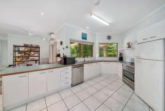  2-8 Drexl Close Gordonvale QLD 4865 $798,000 Welcome to 2-8 Drexl Road, Gordonvale .. Therese Plath is excited to present to the market for the first time in over 20 years this private acreage on 4,419m2 block. The setting is perfect … The location is first class … A fabulous hideaway only 15kms from Cairns City Centre. Welcome to your dream residence nestled on a sprawling 4,419 square meters of lush tranquillity, offering the perfect blend of spacious living and privacy. This inviting haven boasts a meticulously designed brick home, providing the ideal backdrop for a life of comfort and serenity. As you approach, the property unveils itself behind a natural curtain of trees, offering a shield of privacy that sets the stage for a tranquil retreat. The flat and expansive 4,419 square meters of land provide ample space for both relaxation and recreation, offering a canvas for your outdoor aspirations. This outstanding property stands as a testament to quality and style with parklike grounds and a coveted northerly aspect while offering wide open spaces both inside and out. Ultimate privacy and tranquility is assured where you may indulge yourself in your own little world. Situated on a large parcel of land, this solid brick home is a lifestyle concept planned around many entertaining areas. The generous and practical kitchen is ideally placed for quick meal delivery to the dining or outside to a large scale entertaining patio. Glass sliders further open the home up to cooling breezes and natural light while seamlessly transitioning out to the generous outdoor entertaining area and beyond, creating an inviting flor throughout the home. This covered patio creates multiple vantage points for taking in the expansive views while offering year round alfresco living and entertaining looking. Enjoy the peace and quiet- what a fantastic Christmas you'll enjoy here in this perfect venue. There are four bedrooms, main bedrooms serviced by the en-suite and the other three bedrooms has easy access to the family main bathroom. The exterior of the property is a haven for outdoor enthusiasts, featuring a double lock-up garage for secure parking and a shed with its own access, catering to your storage needs or providing a space for hobbies and projects. The expansive yard invites the imagination to run wild, whether you envision lush gardens, a play area for children, or perhaps even a charming outdoor entertaining space. This fully-fenced and private allotment is positioned in a sought after location. The property's prime location gives a semi-rural feel but it retains the suburban advantages of a short 5 minutes' drive to newly completed shopping centre and schools. This property is more than just a residence; it's a sanctuary where the embrace of nature meets the comfort of home. With its combination of spacious interiors, two bathrooms, and the added convenience of a double lock-up garage and shed, this acreage beckons you to experience the perfect blend of modern living and natural seclusion. Welcome to a lifestyle where every detail is designed to enhance your sense of comfort and well-being. 