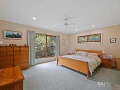  115 Denhams Road Hallston VIC 3953 Located approximately 15 minutes from the township of Leongatha, nestled amongst the rolling green hills and bushland of South Gippsland is this most unique home. A special gem here, built with rock from the earth, it is positioned so beautifully upon to take in the serenity of the native bushland, the tallest of gum trees, and an abundance of bird life. Beginning as a cottage and expanding over the years to create a much-loved family home, this rock, brick and cedar home has character and warmth. Situated on an undulating 32 acres (12.75 ha) a mix of bush surrounds 6 fenced paddocks with the beautiful 'Brookes Creek', meandering through the property. The home features: - Kitchen with gas cook top, double electric oven, breakfast bar and dining space - Cathedral ceilings extend into the formal dining room with a sunken lounge, featured rock walls and wood heater. - High ceilings throughout the home with expansive windows providing views into the treetops. - The spacious lounge room enjoys a second wood heater with gorgeous views across the property and opens out to the front entertainment deck. - A custom designed office doubles as a music sound room, a perfect work from home office - There are three bedrooms with the smaller having built in bookshelves, the second with built in robes and the master complete with ensuite and walk in robe. - The family bathroom has shower, vanity, and toilet with a third external toilet. - The laundry is an ideal mudroom with workspace, storage, and wash tub. - With two wood heaters, 2 reverse cycle air conditioners and ceiling fans, the home is cool or warm, all year round. Externally: - 12.75 HA / 32 ACRES (approx.) fenced with 6 internal paddocks. - The original stone-built studio with stained glass windows is bursting with options for the creative! - An excellent lock up machinery/workshop shed is fully concreted with power. - Assorted original timber and cedar buildings provide car parking and sundry shedding. - Excellent water storage plus access to the permanent Brookes Creek Located 15 minutes from the nearby towns of Leongatha and Mirboo North, 35 minutes to the pristine beaches of Inverloch and within 1.5 hours to Melbourne's Southeastern Suburbs. This point of difference, soulful property is truly something special and most worthy of your consideration. 