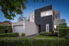  Unit 1/5 Howe St Murrumbeena VIC 3163 $1,400,000 Get ready and get set to fall in love freestanding front residence, offering the supreme flexibility of four bedrooms and dual living with ducted vacumm system, and all the space you need and more within a family-friendly location so close to Murrumbeena Park and junior sports clubs. Its all in store for you and more here, starting with high quality finishes including impressive frontage to Howe Street, rich timber floors, wide hallways and of course, streaming north-western sun that bathes the entire rear living space in natural light. Beyond the hallway, youll love coming home to a gourmet kitchen with stone benches, gloss cabinetry and stainless steel Bosch appliances, where you can entertain in the adjoining dining area, relax in the spacious rear lounge, head outdoors to your private deck and lawns, or even send the kids upstairs to their very own retreat. With the main bedroom downstairs, peace and quiet will be yours, complete with a walk-in robe and fully-tiled ensuite with walk-in shower, while the rest of the bedrooms are upstairs; all a great size with built-in robes and another immaculate bathroom. With a powder room, numerous linen closets, alarm, central heating/cooling, spacious laundry and an extra large garage (with extra OSP in front), this home is a quick stroll to the park, five minutes to Hughesdale station and cafes as well as close to the Murrumbeena shops to create the perfect combination of high quality and low-maintenance. 